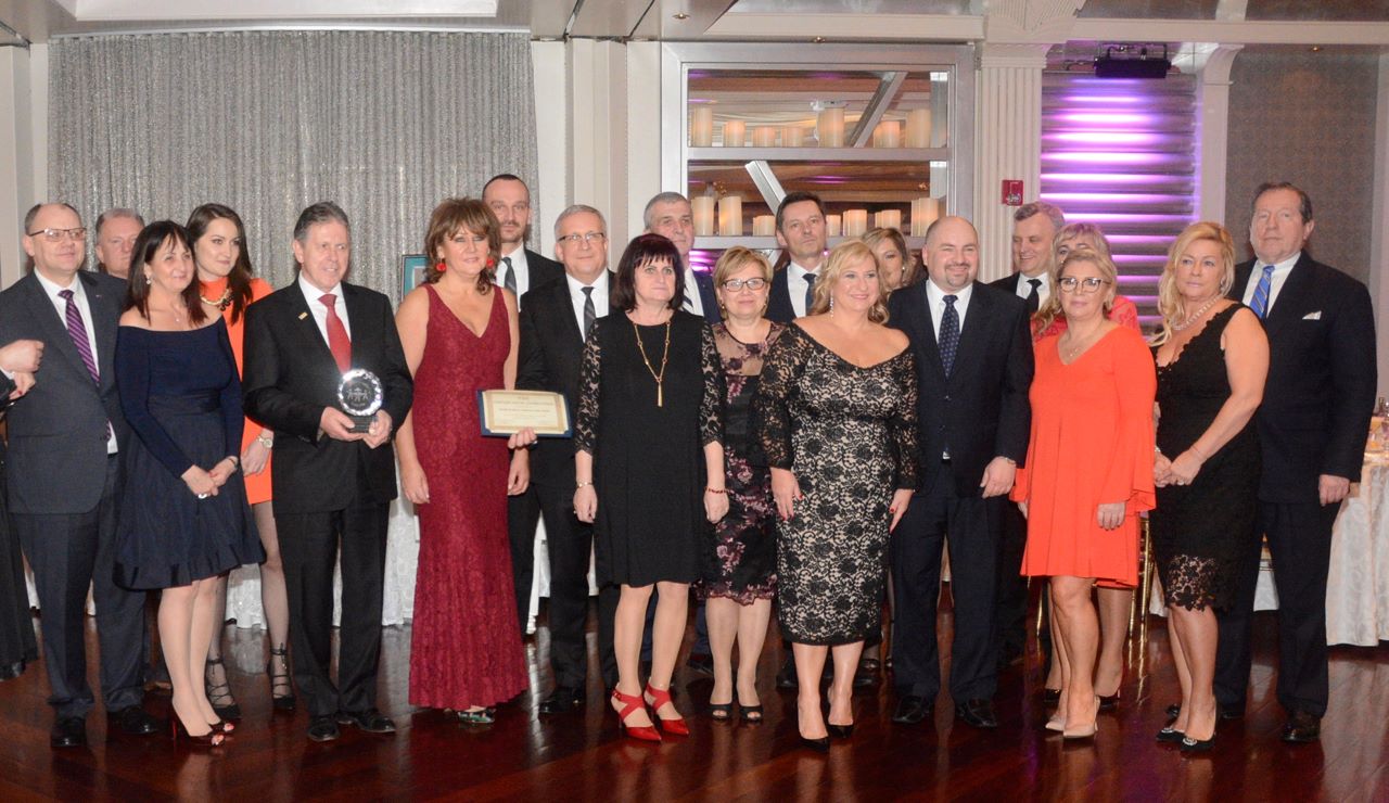 PSFCU Board of Directors members and employees with an award