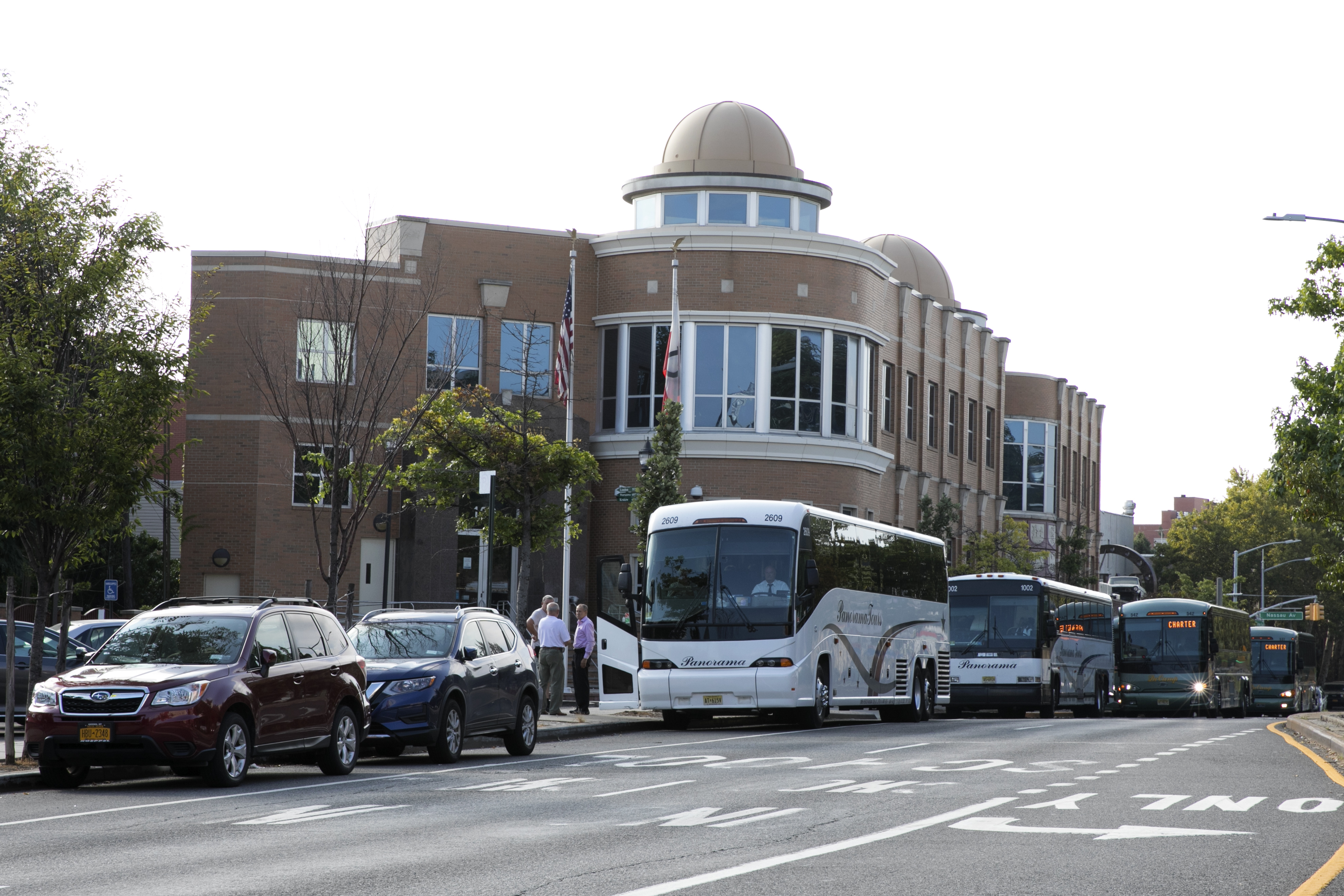 Buses waiting for pilgrims at PSFCU Headquarters in Greenpoint